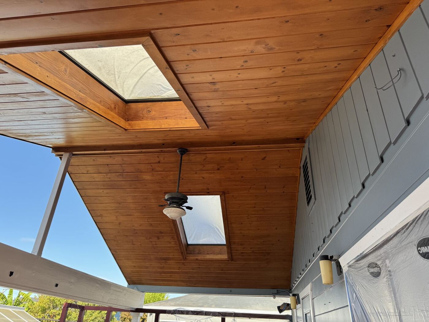 Cottage Exterior Repaint with Cedar Ceiling & Deck Restoration photo 6