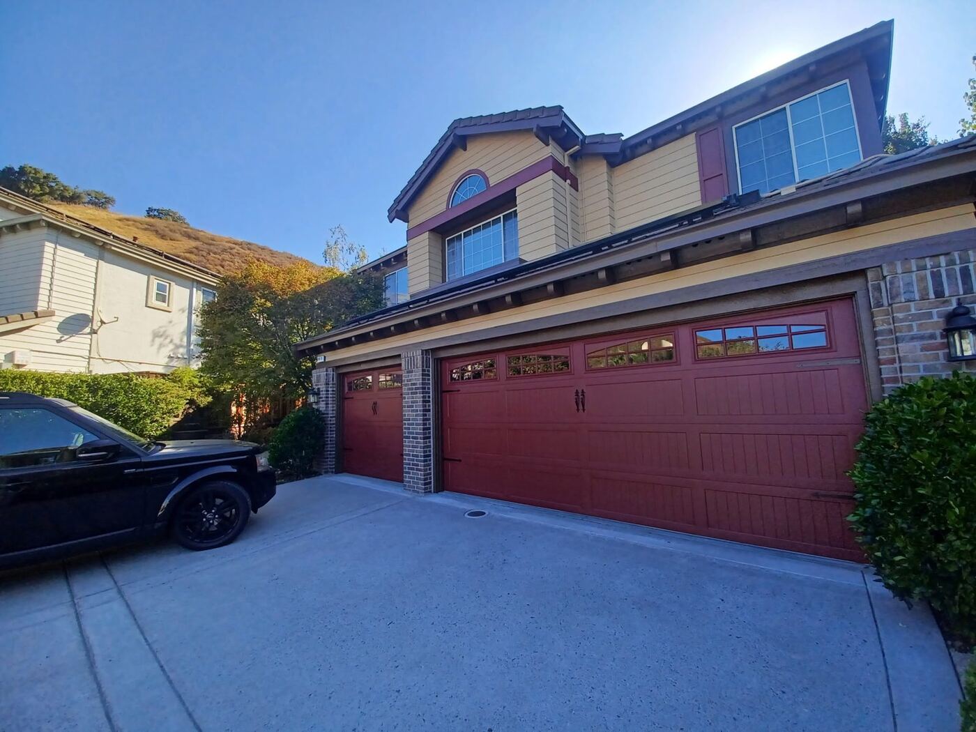 Two-Story Exterior Repaint with New Garage Door Color photo 2