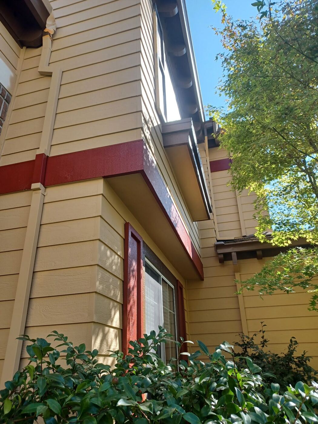 Two-Story Exterior Repaint with New Garage Door Color photo 4