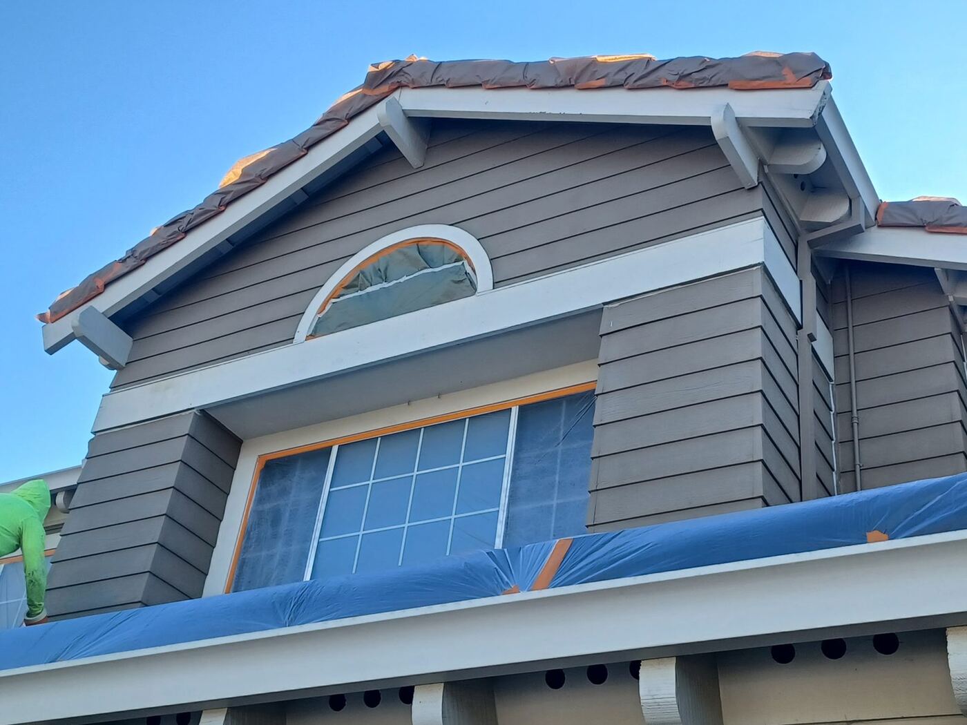 Two-Story Exterior Repaint with New Garage Door Color photo 10